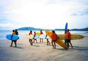 Walking to surf Tamarindo