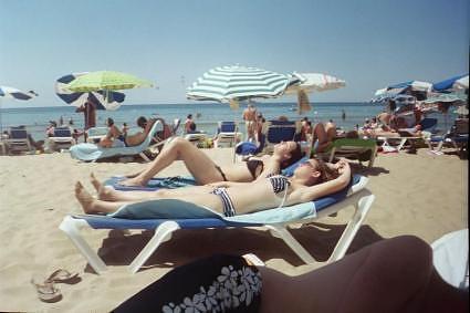 sunbathing on the beaches of benidorm